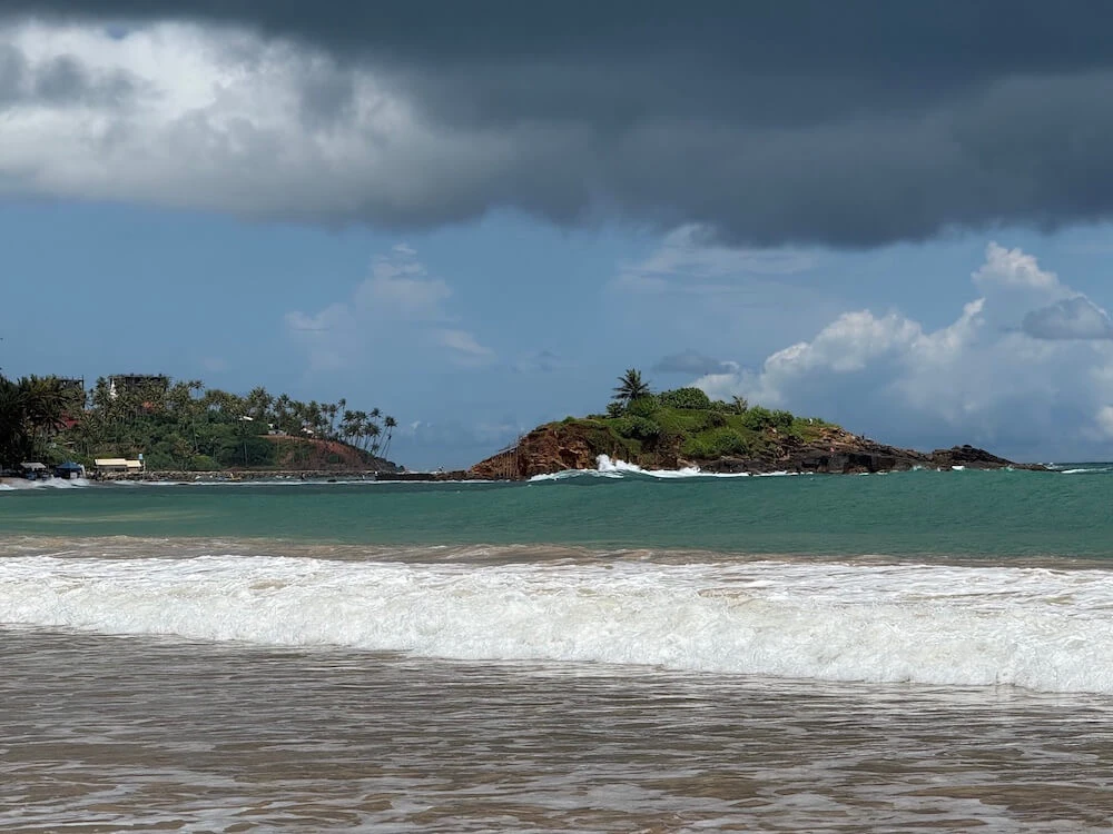 Parrot Rock rising from the sea at Mirissa