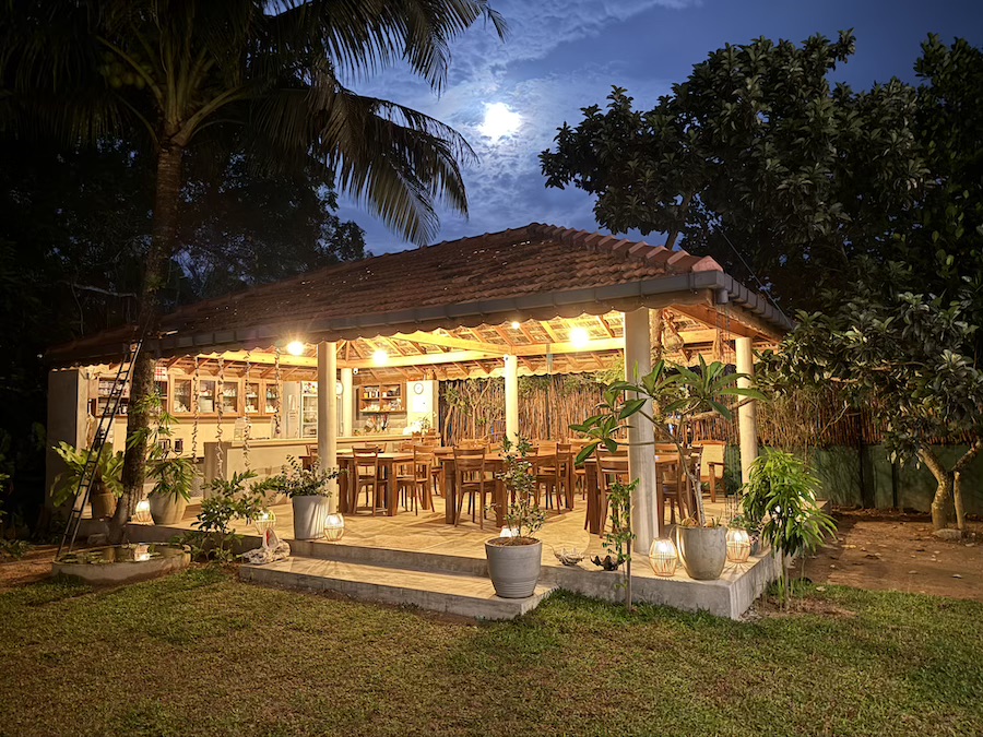 The open-air garden pavilion lit up in the evening